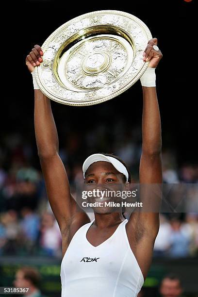 Venus Williams of USA holds the trophy after Williams won in three sets against Lindsay Davenport of USA during the Ladies Final on twelfth day of...