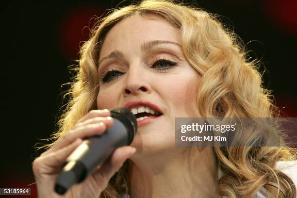 Singer Madonna performs on stage at "Live 8 London" in Hyde Park on July 2, 2005 in London, England. The free concert is one of ten simultaneous...