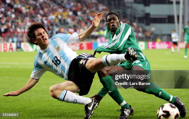 Lionel Messi from Argentina in action with Dele Adeleye from Nigeria during the FIFA World Youth Championships 2005 Final between Argentina and...