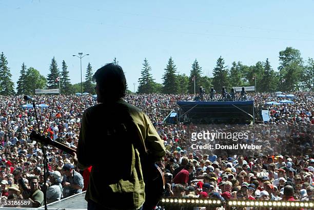 Blue Rodeo performs during "Live 8 Canada" on July 2, 2005 in Barrie, Ontario, Canada. The free concert is one of ten simultaneous international gigs...
