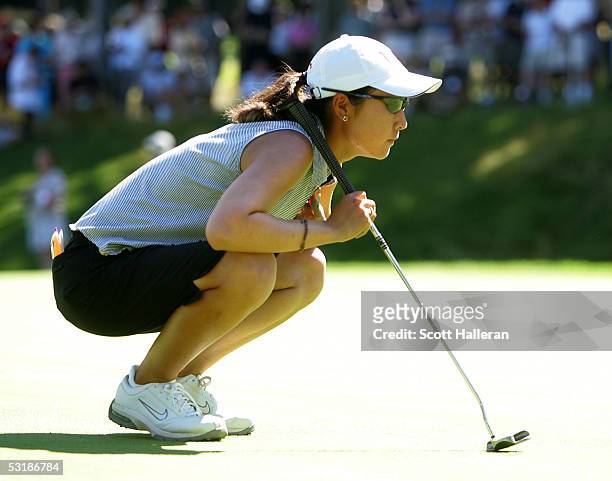 Candie Kung lines up a putt on the 17th green during her match with Annika Sorenstam of Sweden during the quarter-finals of the HSBC World Match Play...