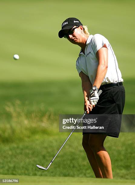 Karrie Webb of Australia plays a pitch shot on the 14h hole during her match with Marisa Baena of Colombia during the quarter-finals of the HSBC...