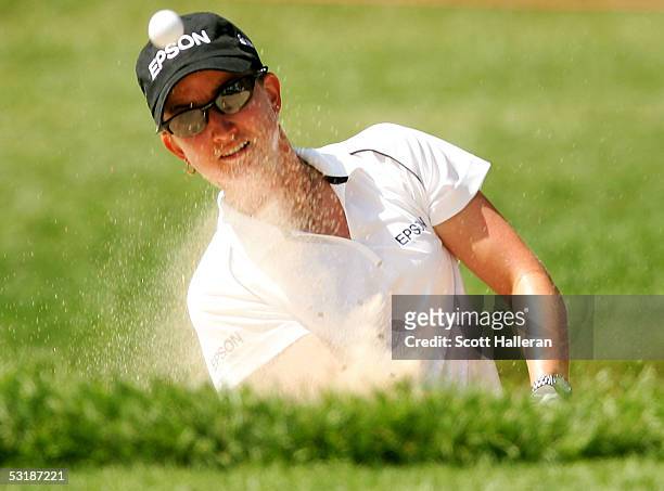 Karrie Webb of Australia plays a bunker shot on the 15th hole during her match with Marisa Baena of Colombia during the quarter-finals of the HSBC...