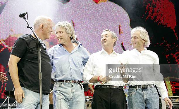 Musicians David Gilmour, Roger Waters, Nick Mason and Richard Wright from the band Pink Floyd are seen on stage at "Live 8 London" in Hyde Park on...