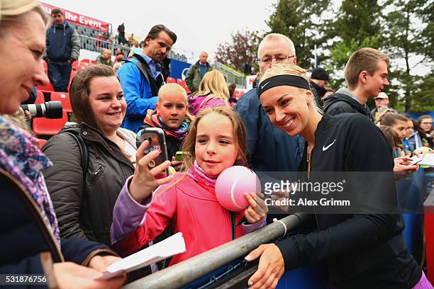 Sabine Lisicki of Germany takes selfies with fans after defeating Laura Arruabarrena of Spain during day four of the Nuernberger Versicherungscup...