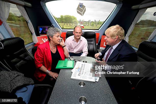 Boris Johnson MP, Labour MP Gisela Stuart and UKIP MP Douglas Carswell have a meeting on board the Vote Leave, Brexit Battle Bus on May 17, 20016 in...