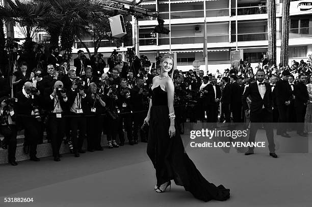 German model Toni Garrn poses as she arrives on May 16, 2016 for the screening of the film "Loving" at the 69th Cannes Film Festival in Cannes,...