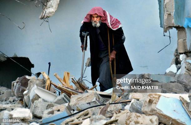 Palestinian Khalil al-Smak walks on the rubble of his house, destroyed by an Israeli bulldozer in Rafah refugee camp in the southern of Gaza strip 10...