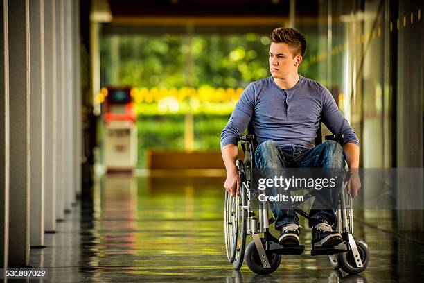 young man in a wheelchair - serious injury stock pictures, royalty-free photos & images