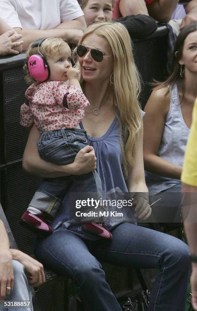 Actress Gwyneth Paltrow and daughter Apple watch Coldplay singer Chris Martin perform on stage at "Live 8 London" in Hyde Park on July 2, 2005 in...