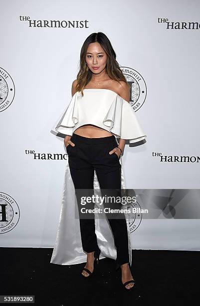 Aimee Song attends The Harmonist Cocktail Party during The 69th Annual Cannes Film Festival at Plage du Grand Hyatt on May 16, 2016 in Cannes.