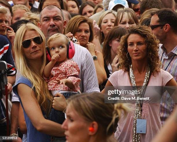 Gwyneth Paltrow and her daughter Apple watch from the audience at "Live 8 London" in Hyde Park on July 2, 2005 in London, England. The free concert...