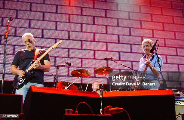 Pink Floyd's David Gilmour and Roger Waters perform on stage at "Live 8 London" in Hyde Park on July 2, 2005 in London, England. The free concert is...