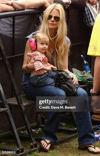 Gwyneth Paltrow holds her daughter Apple as they watch "Live 8 London" in Hyde Park on July 2, 2005 in London, England. The free concert is one of...