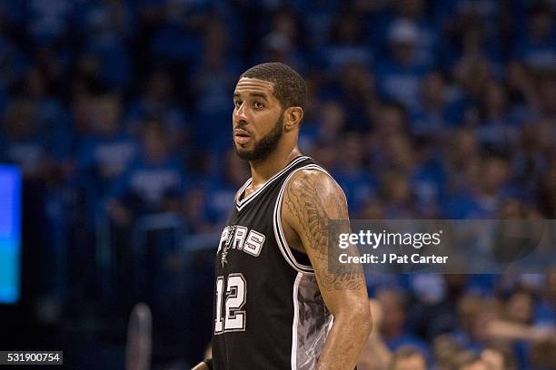 LaMarcus Aldridge of the San Antonio Spurs pauses as he watches game action against the Oklahoma City Thunder during the second half of Game Six of...