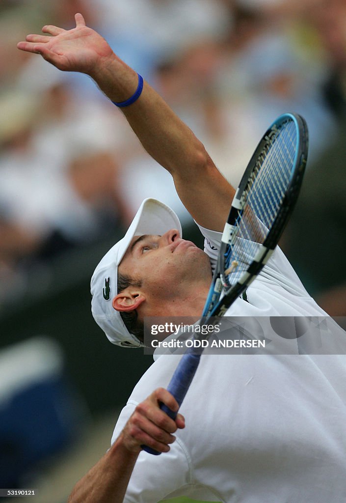 Andy Roderick Serving Andy Roddick of US hits serves to Roger Federer of Switzerland during ...