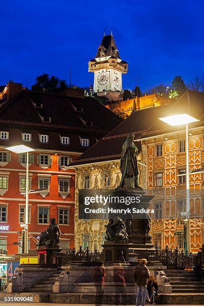 the fountain on hauptplatz and uhrturm in graz - graz austria stock pictures, royalty-free photos & images