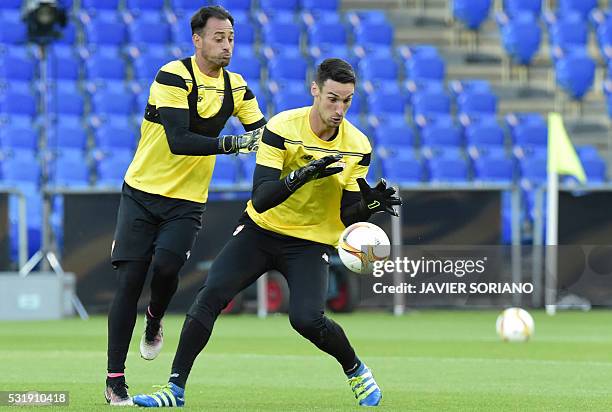 Sevilla's goalkeeper Sergio Rico Gonzalez and Sevilla's Portuguese goalkeeper Beto take part in a training session at the St Jakob-Park stadium in...