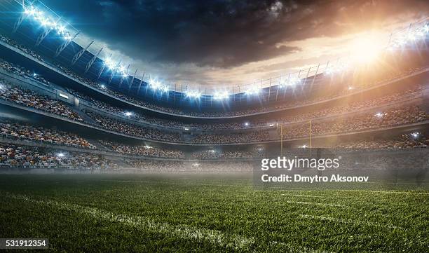 dramatic american football stadium - american football field stock pictures, royalty-free photos & images