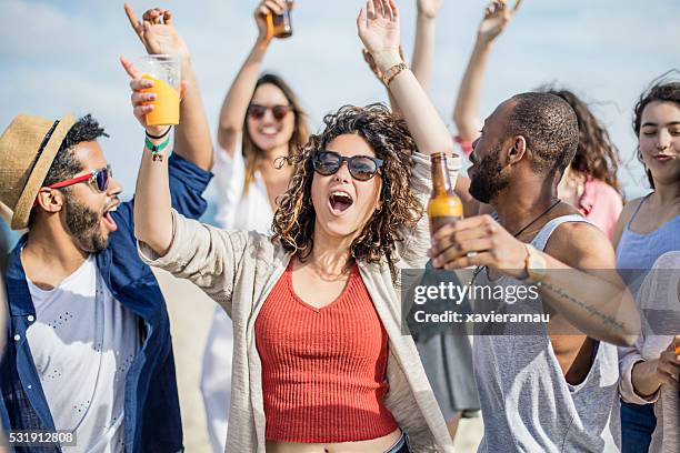 friends having fun on a party at the beach - beach music festival stock pictures, royalty-free photos & images