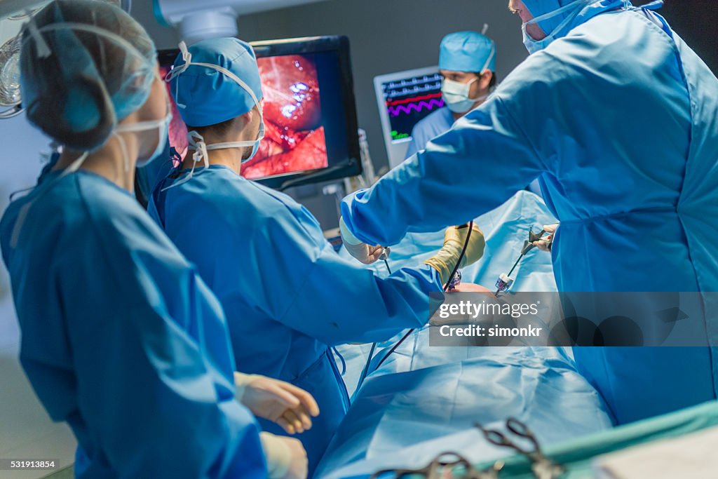 Surgeons in operating theatre