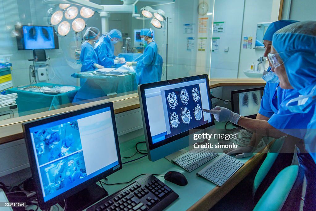 Doctor working in hospital's control room