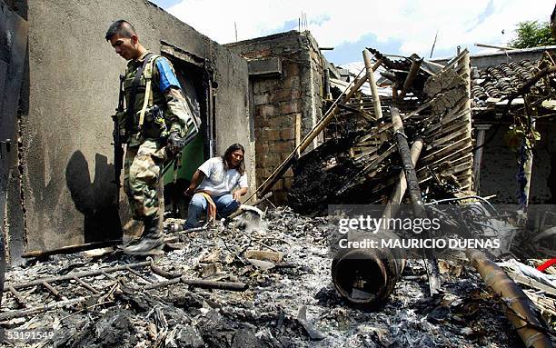 Colombian soldier checks the wreckage of a house after a gas cylinder bombs attack by the leftist guerrillas FARC in Caldono, state of Cauca, 03 July...