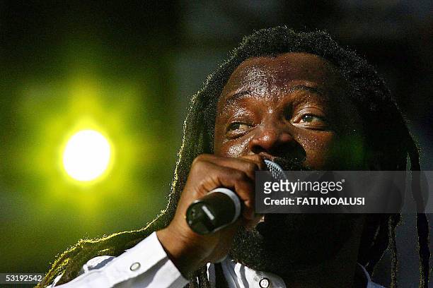 Johannesburg, SOUTH AFRICA: South African reggae singer Lucky Dube performs at the global call concert against poverty in Johannesburg, South Africa,...