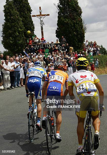 La Chataigneraie, France: Frenchman Nicolas Portal , Dutch Erik Dekker and Spaniard David Canada ride during their breakaway in the 92nd Tour de...