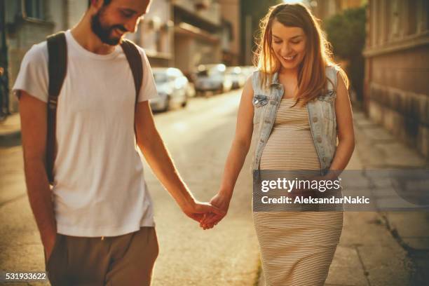 pregnancy walk around the city - pregnant woman car stock pictures, royalty-free photos & images