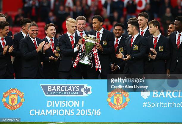 James Weir, Devonte Redmond and Manchester United team mates celebrate with Barclays Under-21 Premier League trophy prior to the Barclays Premier...