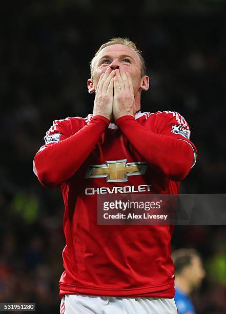 Wayne Rooney of Manchester United celebrates as he scores their first goal during the Barclays Premier League match between Manchester United and AFC...