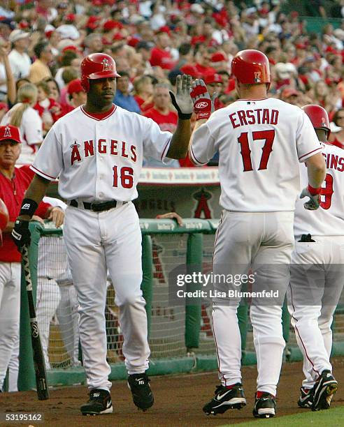 Darin Erstad of the Los Angeles Angels of Anaheim returns to the dugout after hitting a two-run-homerun in the 1st inning against the Minnesota Twins...