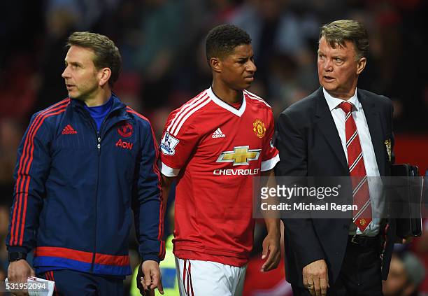 Louis van Gaal manager of Manchester United and Marcus Rashford of Manchester United look on at half time during the Barclays Premier League match...