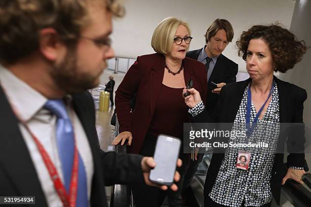 Sen. Claire McCaskill talks with reporters while heading to the weekly Senate Democratic policy luncheon at the U.S. Capitol May 17, 2016 in...