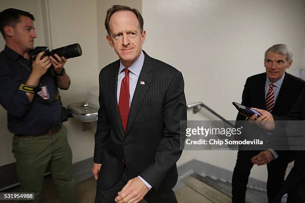 Sen. Patrick Toomey and Sen. Rob Portman head for the weekly Senate Republican policy luncheon in the U.S. Capitol May 17, 2016 in Washington, DC....