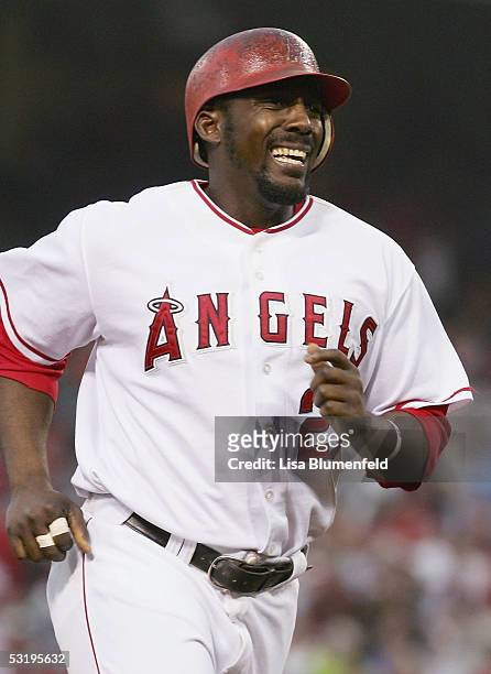 Vladimir Guerrero of the Los Angeles Angels of Anaheim runs the bases after hitting a homerun in the 6th inning against the Minnesota Twins on July...