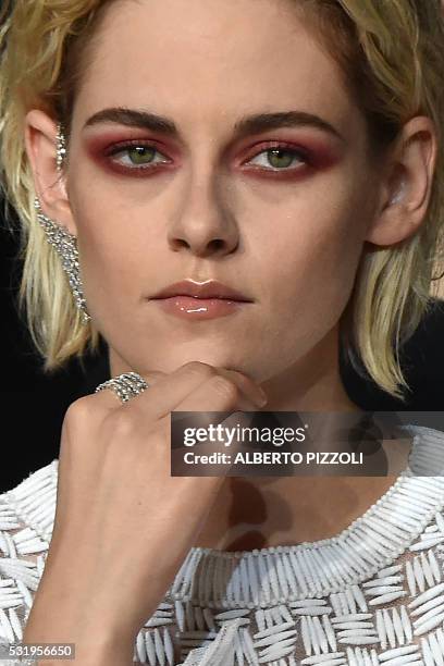 Actress Kristen Stewart poses as she arrives on May 17, 2016 for the screening of the film "Personal Shopper" at the 69th Cannes Film Festival in...