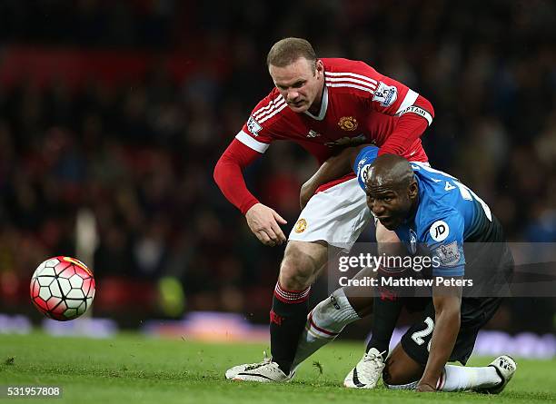 Wayne Rooney of Manchester United in action with Benik Afobe of AFC Bournemouth during the Barclays Premier League match between Manchester United...