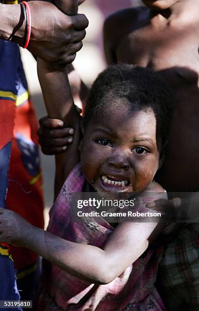 Young African boy who has lost his parents though Aids cries on July 1, 2005 in Mozambique. Since Mozambique's 15-year civil war ended in 1992, the...