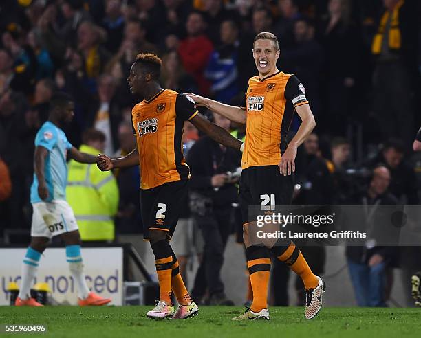 Michael Dawson and Moses Odubajo of Hull City celebrate on the final whistle during the Sky Bet Championship Play Off semi final second leg match...