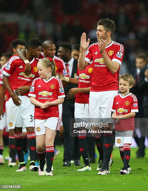 Michael Carrick of Manchester United and family walk around the pitch after the Barclays Premier League match between Manchester United and AFC...