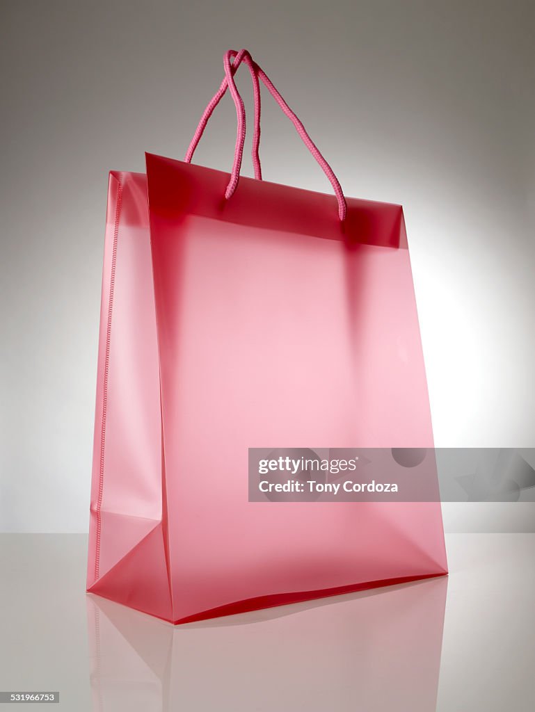 Empty red plastic shopping bag