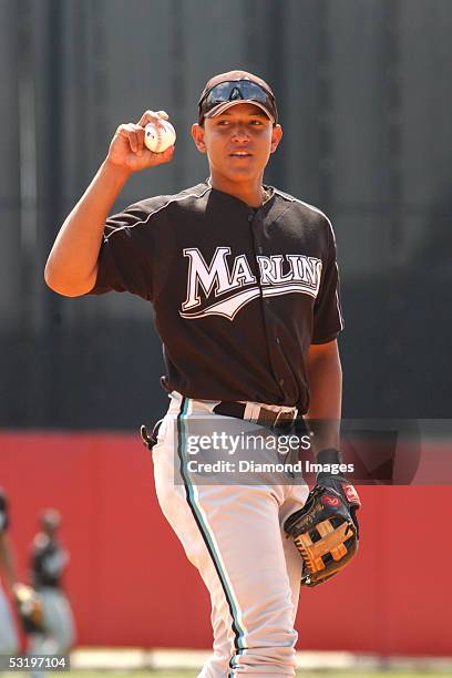 Infielder Miguel Cabrera of the Florida Marlins takes ground balls at thirdbase during batting practice prior to a Spring Training game on March 17,...