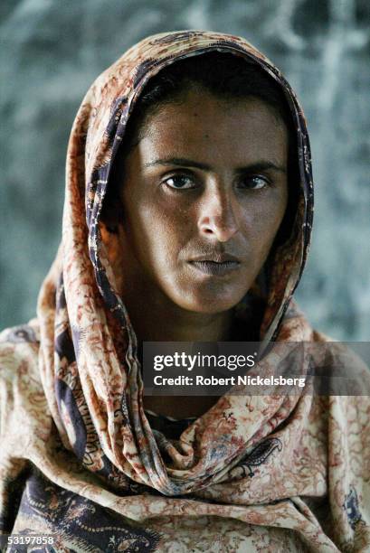 Mukhtiar Mai, who was gang raped by 6 men from a more powerful clan living next door on June 22 poses August 25, 2004 in Jatoimeerwala, Pakistan. She...