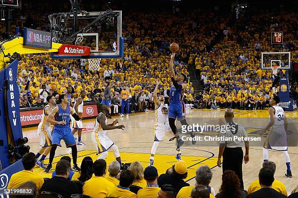 Russell Westbrook of the Oklahoma City Thunder attempts a shot over Stephen Curry of the Golden State Warriors during game one of the NBA Western...