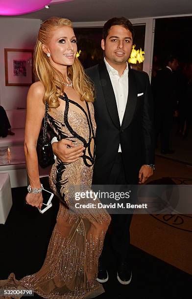 Paris Hilton and Jamie Reuben attend the de Grisogono party during the 69th Cannes Film Festival at Hotel du Cap-Eden-Roc on May 17, 2016 in Cap...