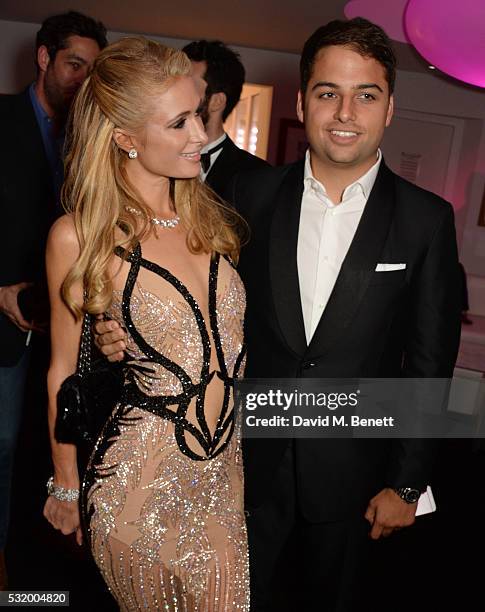 Paris Hilton and Jamie Reuben attend the de Grisogono party during the 69th Cannes Film Festival at Hotel du Cap-Eden-Roc on May 17, 2016 in Cap...