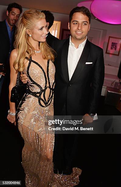 Paris Hilton and Jamie Reuben attend the de Grisogono party during the 69th Cannes Film Festival at Hotel du Cap-Eden-Roc on May 17, 2016 in Cap...