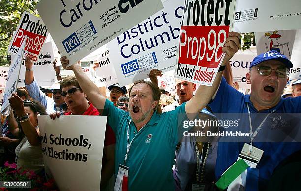 Members of the National Education Association chant at the end of a march to California Gov. Arnold Schwarzenegger's office to deliver petitions...